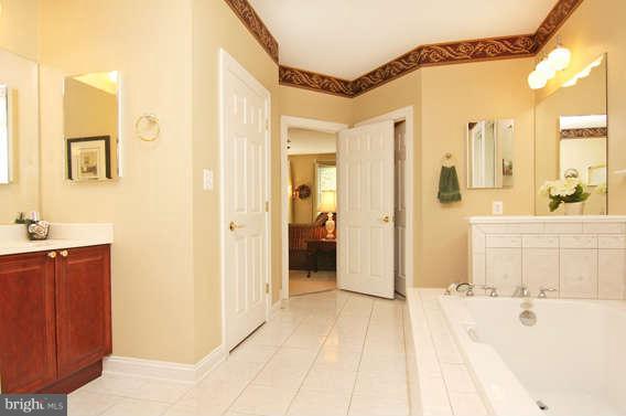 3011 Belford Road Finksburg, MD 21048 - Photo 20 of 30 a bathroom with a bathtub and a shower