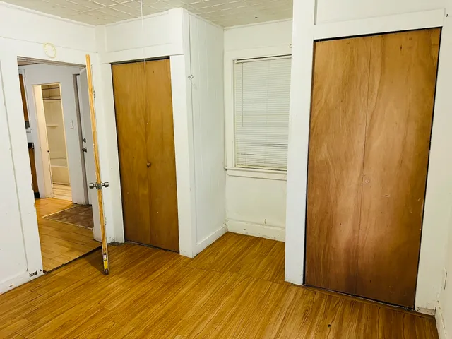 a view of front door with wooden floor