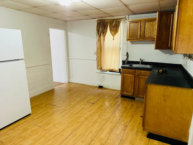 a kitchen with a sink appliances and cabinets