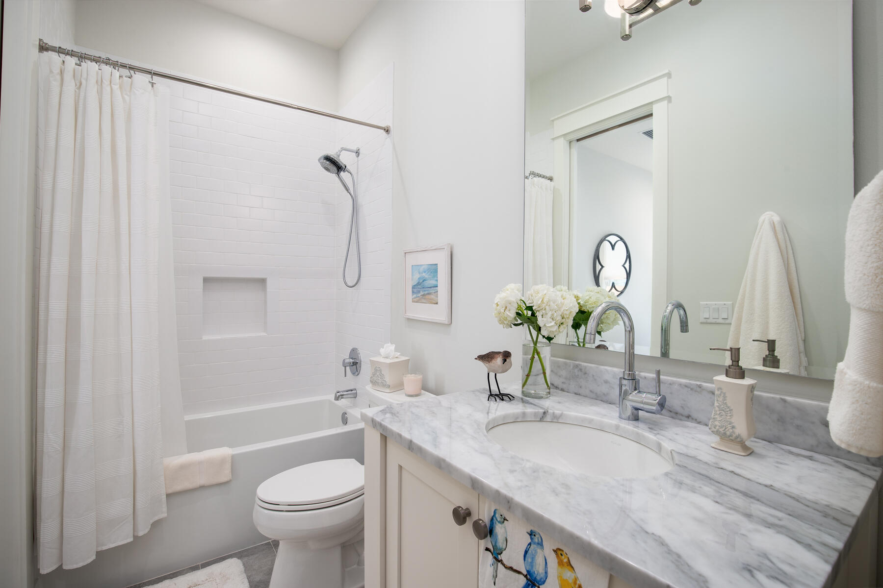 91 Catface Drive Watersound, FL 32461 - Photo 16 of 40 a bathroom with a granite countertop sink toilet and shower
