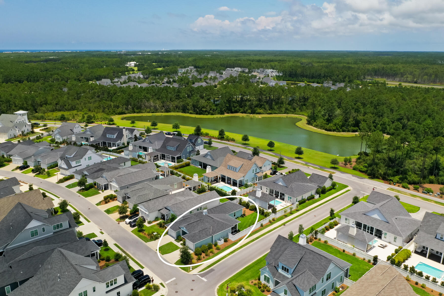 91 Catface Drive Watersound, FL 32461 - Photo 27 of 40 an aerial view of a city with lots of residential buildings and mountain view in back