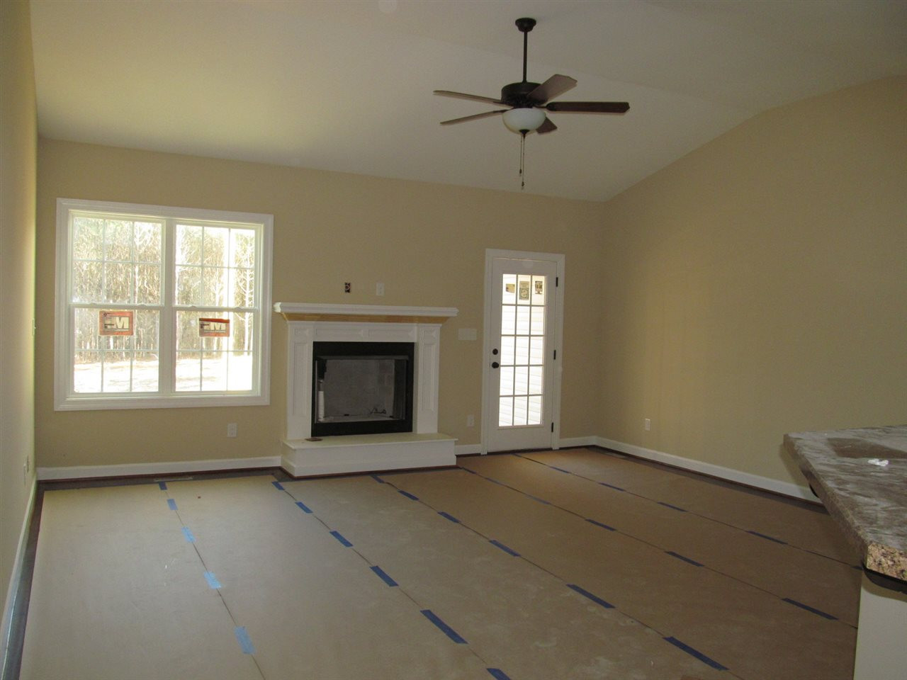 17 Savannah Ridge Court Angier, NC 27501 - Photo 4 of 24 Large Vaulted Family Room with Hardwoods and Gas Log Fireplace Family Room