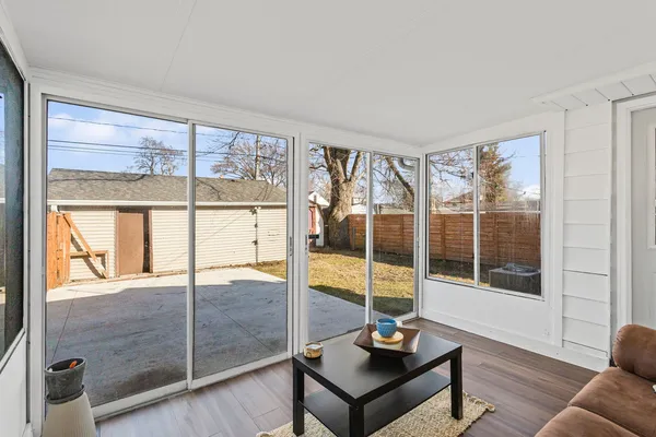 a living room with a large window and outer view