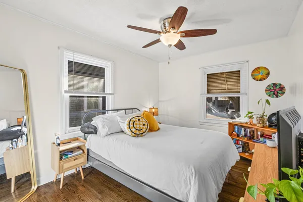 a bedroom with a bed and a window