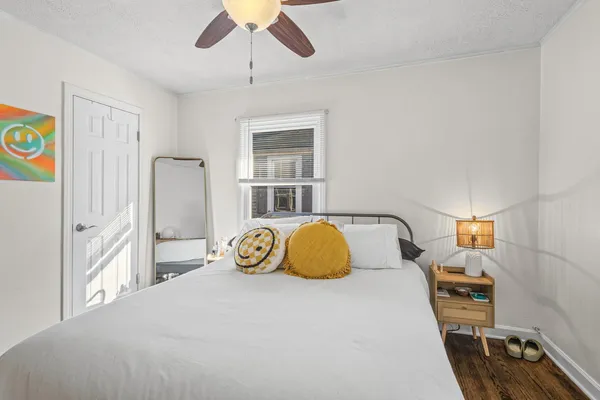 a bedroom with bed and window
