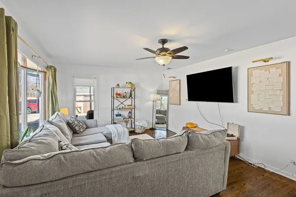 a living room with furniture and a flat screen tv