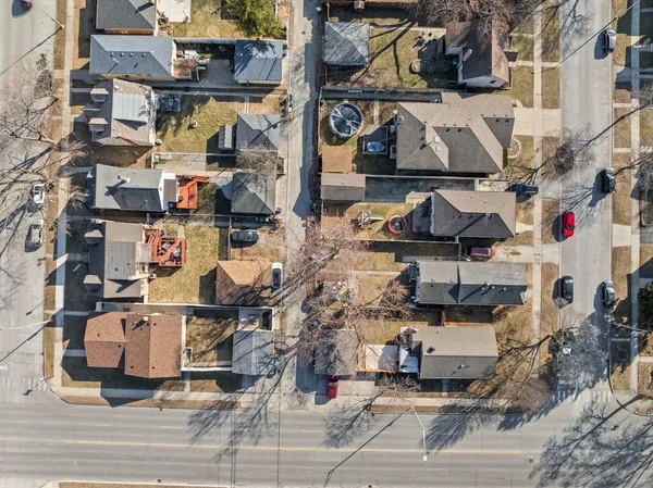 an aerial view of a house with a yard
