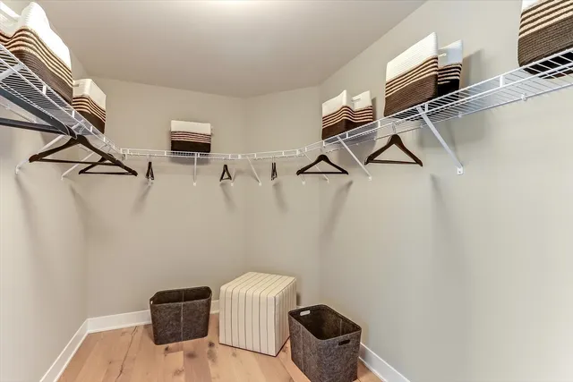 a view of storage and utility room with racks on the wall