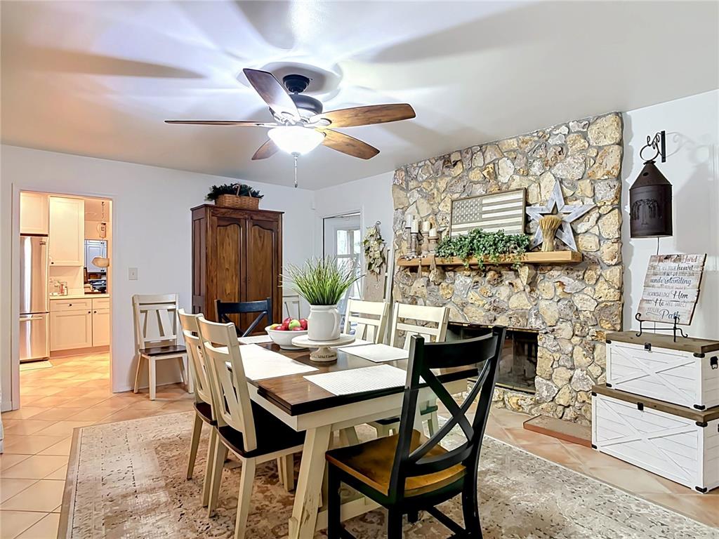 1395 Maytown Road Osteen, FL 32764 - Photo 20 of 65 a view of a dining room with furniture and a chandelier
