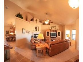 2375 North Reed Road, Unit 1 Chino Valley, AZ 86323 - Photo 3 of 9 a living room with furniture a flat screen tv and kitchen view
