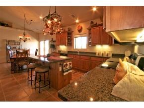2375 North Reed Road, Unit 1 Chino Valley, AZ 86323 - Photo 4 of 9 a kitchen with a sink cabinets and dining table