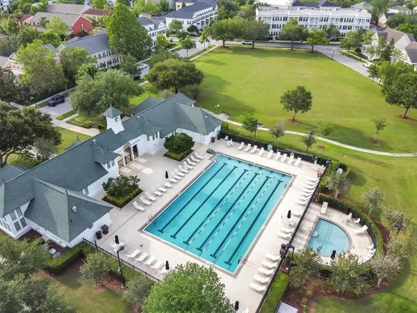 an aerial view of a house with a lake view