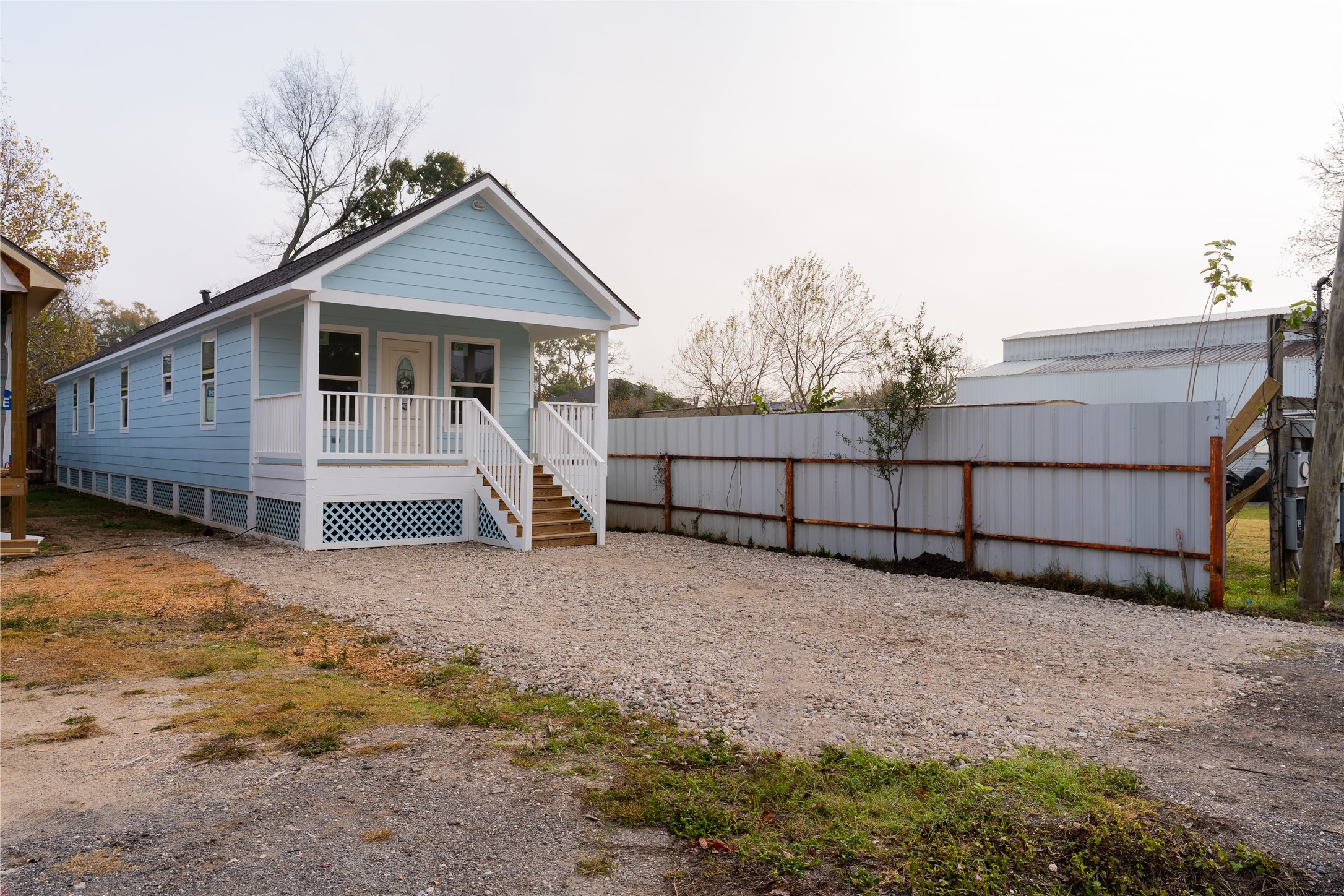 4425 7th Street Bacliff, TX 77518 - Photo 2 of 16 a view of a house with wooden fence