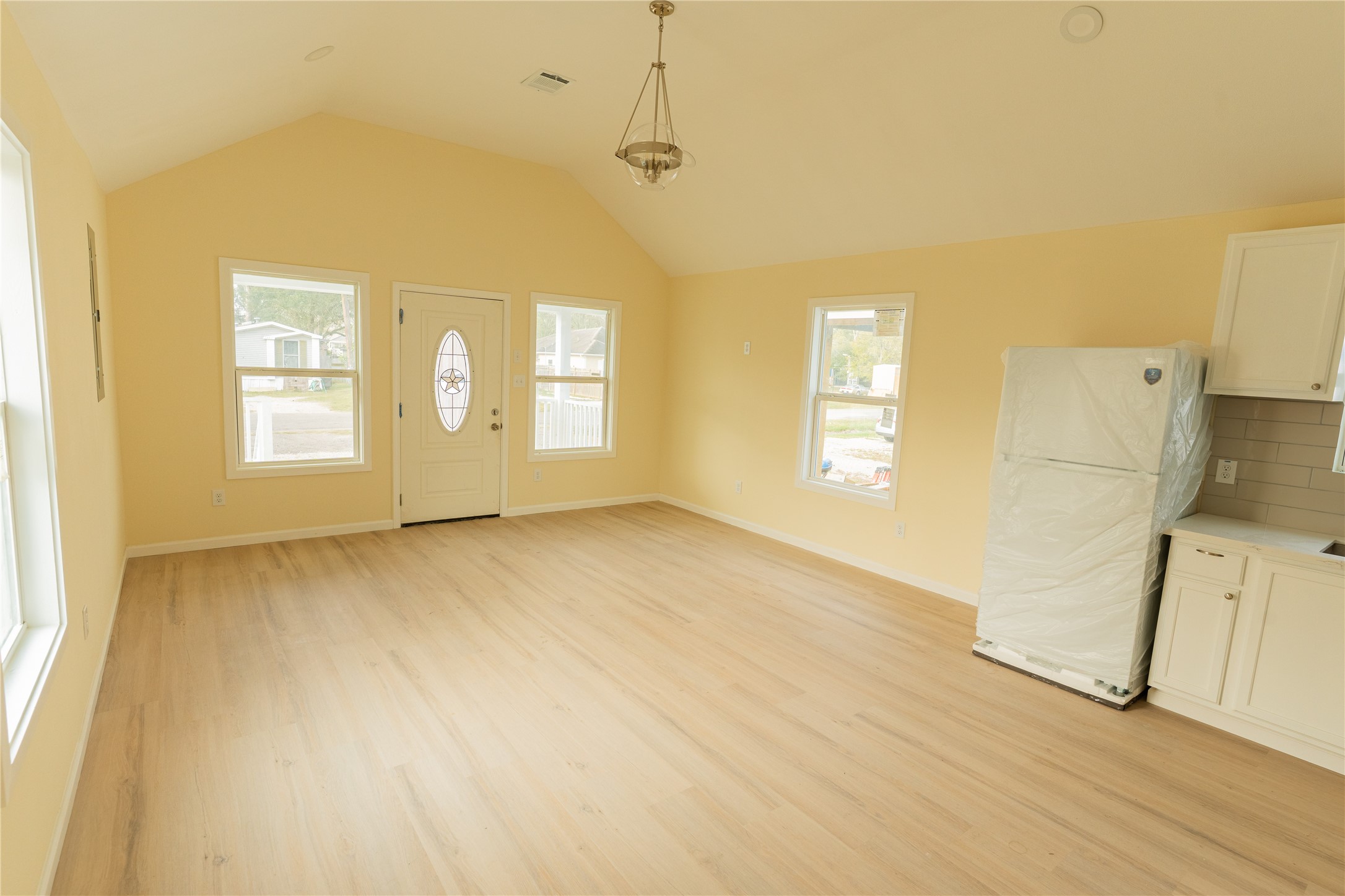 4425 7th Street Bacliff, TX 77518 - Photo 5 of 16 wooden floor in an empty room with a window