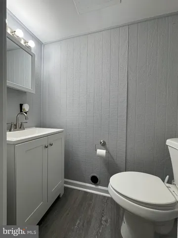 a bathroom with a toilet a sink and shower