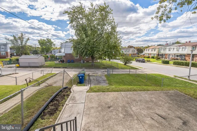 a view of a yard with swimming pool