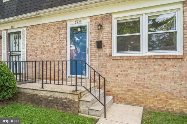 a view of front door of house with yard