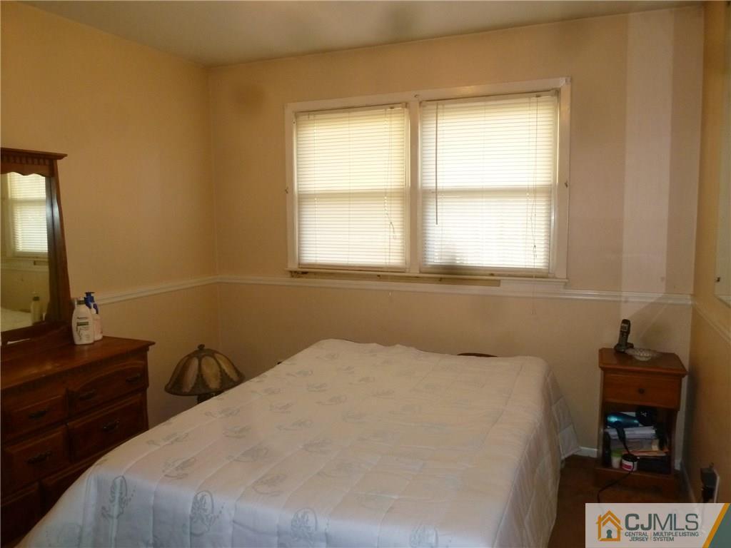 108 Kimberly Road Colonia, NJ 07067 - Photo 4 of 14 a bedroom with a bed and a window