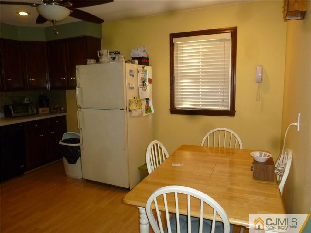 108 Kimberly Road Colonia, NJ 07067 - Photo 8 of 14 a blue kitchen with a refrigerator and a sink