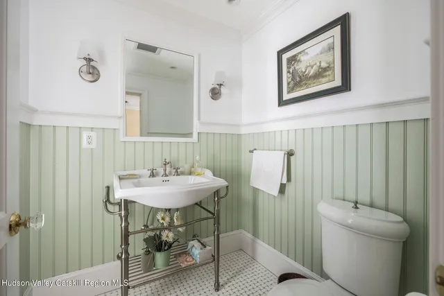 a bedroom with a large bed and a couch