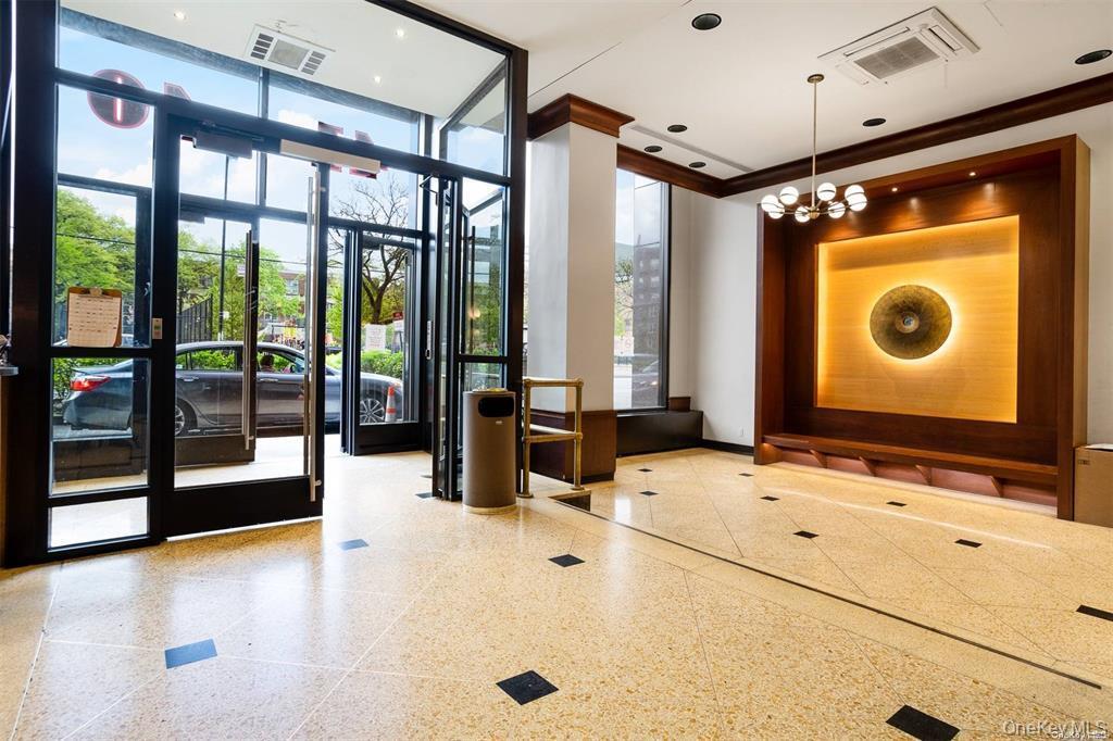 41-40 Union Street, Unit 16D Queens, NY 11355 - Photo 3 of 12 a bathroom with a tub mirror and window