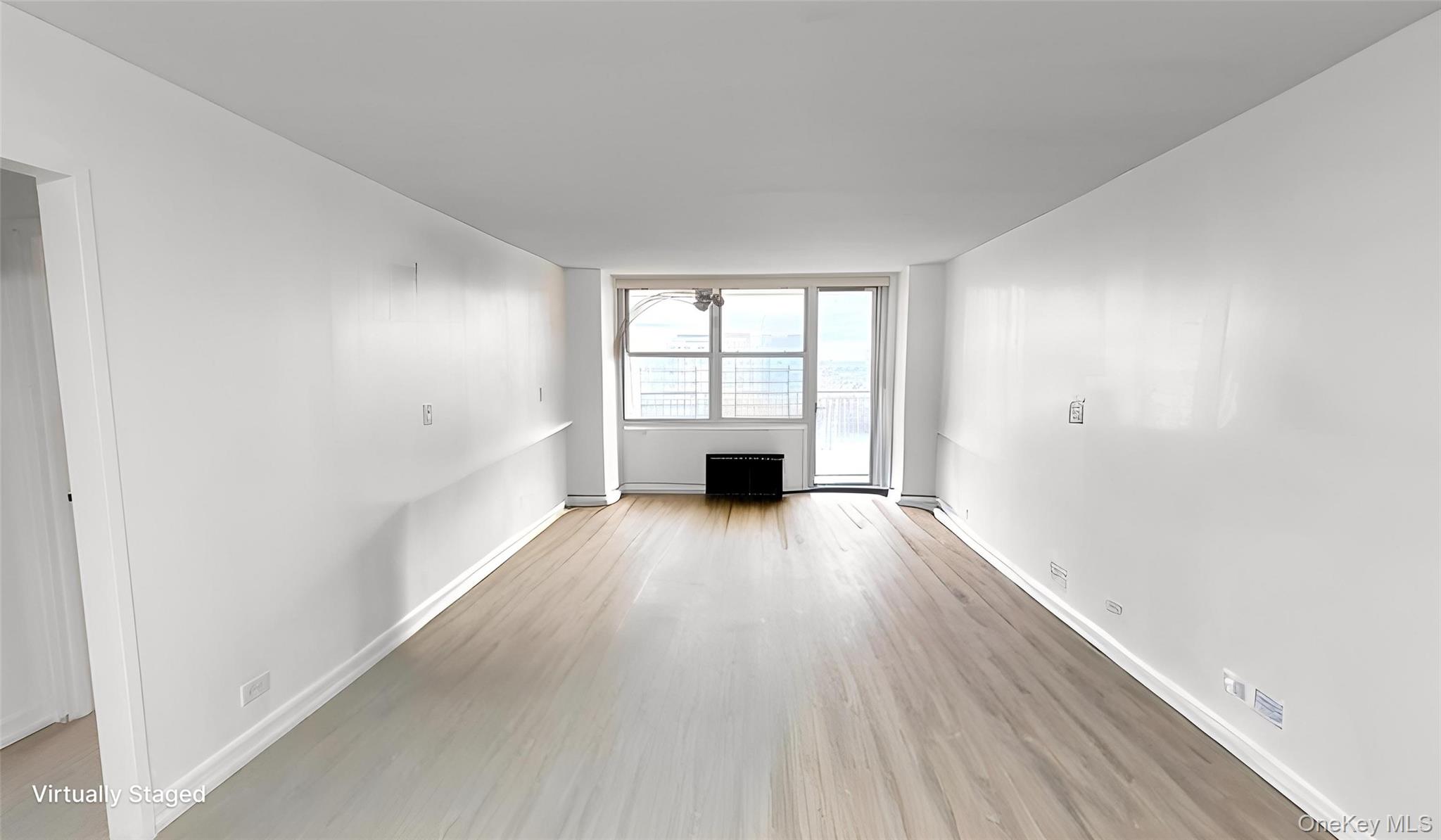 41-40 Union Street, Unit 16D Queens, NY 11355 - Photo 7 of 12 wooden floor in an empty room with a window