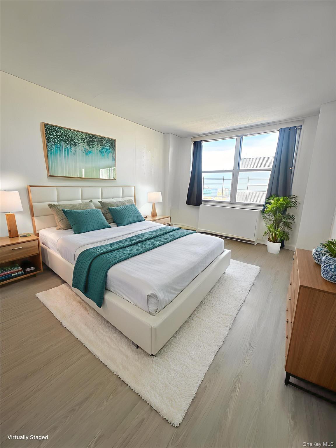 41-40 Union Street, Unit 16D Queens, NY 11355 - Photo 8 of 12 a bedroom with a large bed and a couch