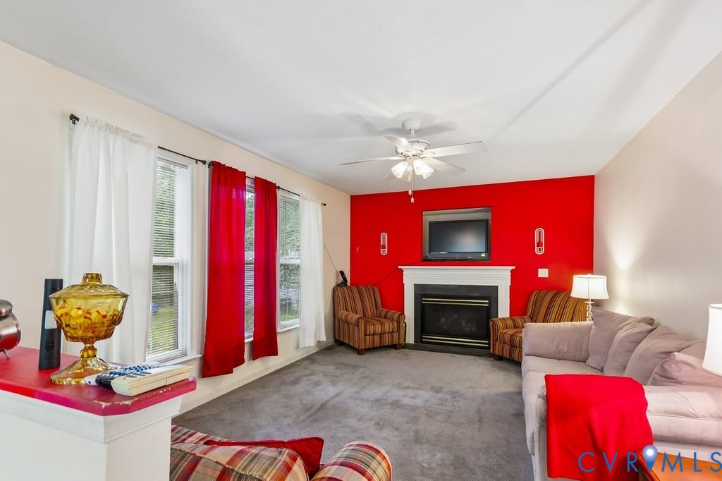 83 Albertson Court Ruther Glen, VA 22546 - Photo 13 of 25 Living area featuring a white mantel fireplace wit