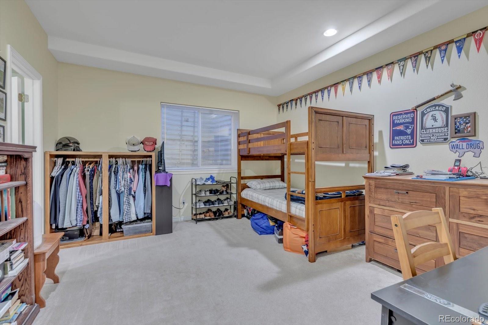 4786 Rabbit Mountain Road Broomfield, CO 80020 - Photo 21 of 41 a bed room with a bed and a desk