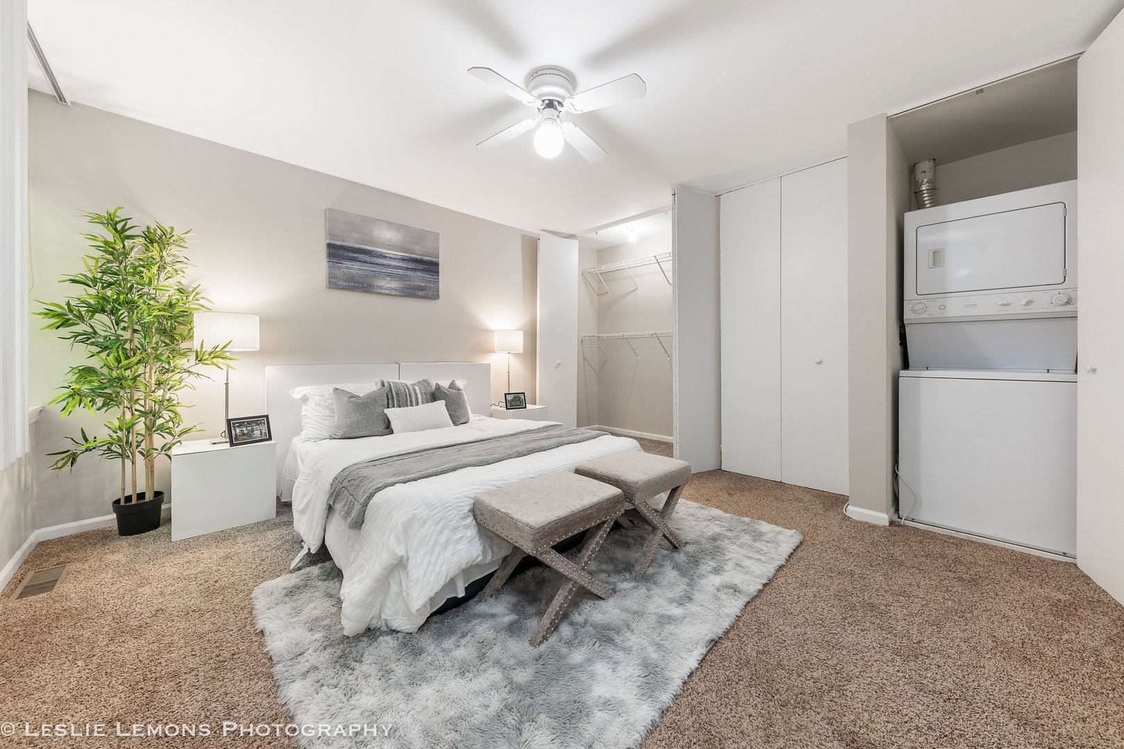 5902 Forest View Road, Unit 1C Lisle, IL 60532 - Photo 12 of 34 a spacious bedroom with a bed and a chandelier