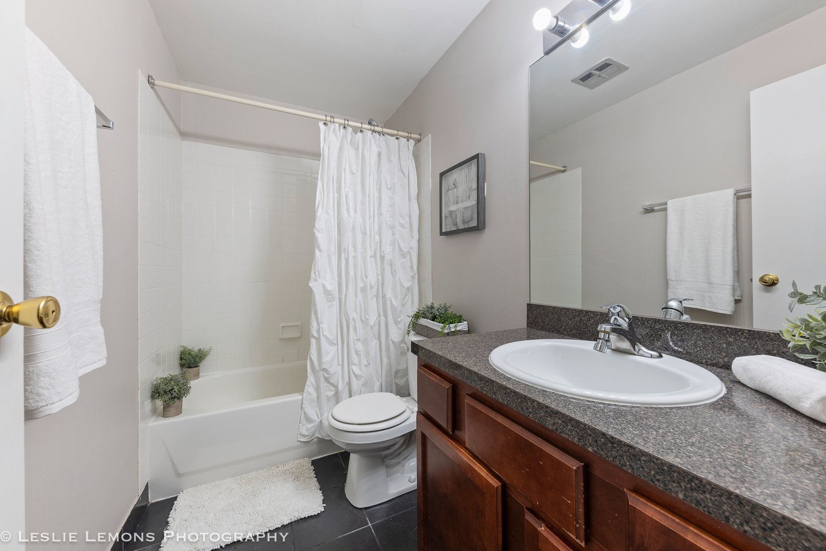 5902 Forest View Road, Unit 1C Lisle, IL 60532 - Photo 14 of 34 a bathroom with a granite countertop sink toilet and shower