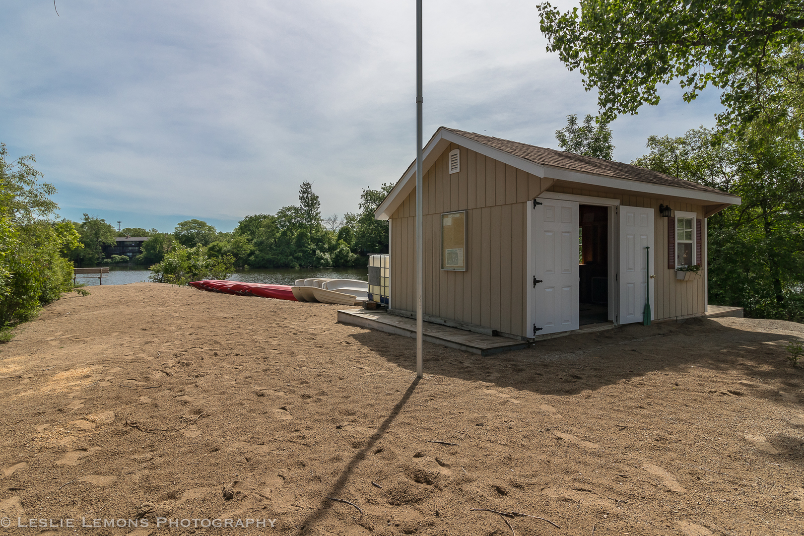 5902 Forest View Road, Unit 1C Lisle, IL 60532 - Photo 24 of 34 a backyard of a house with a yard and garage