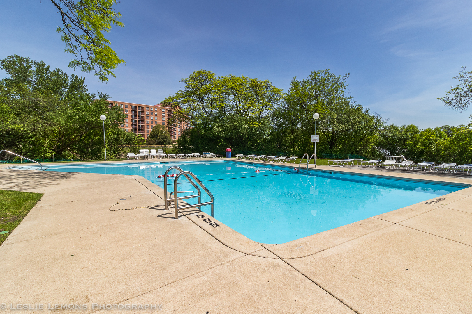 5902 Forest View Road, Unit 1C Lisle, IL 60532 - Photo 30 of 34 a view of a swimming pool with an outdoor space and seating area