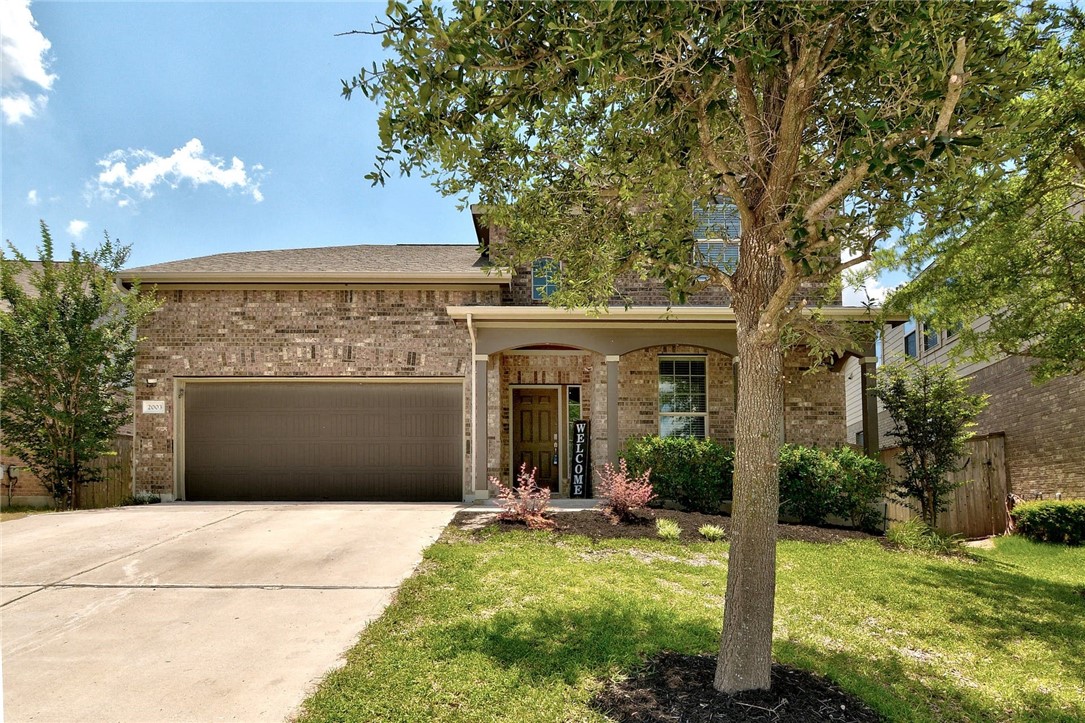 2003 Autumn Run Lane Round Rock, TX 78665 - Photo 1 of 1 a front view of a house with garden