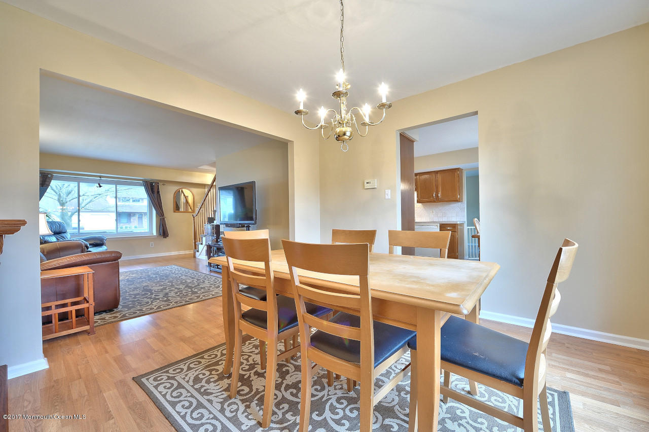 90 Starlight Road Howell, NJ 07731 - Photo 11 of 40 a view of a dining room with furniture window and wooden floor