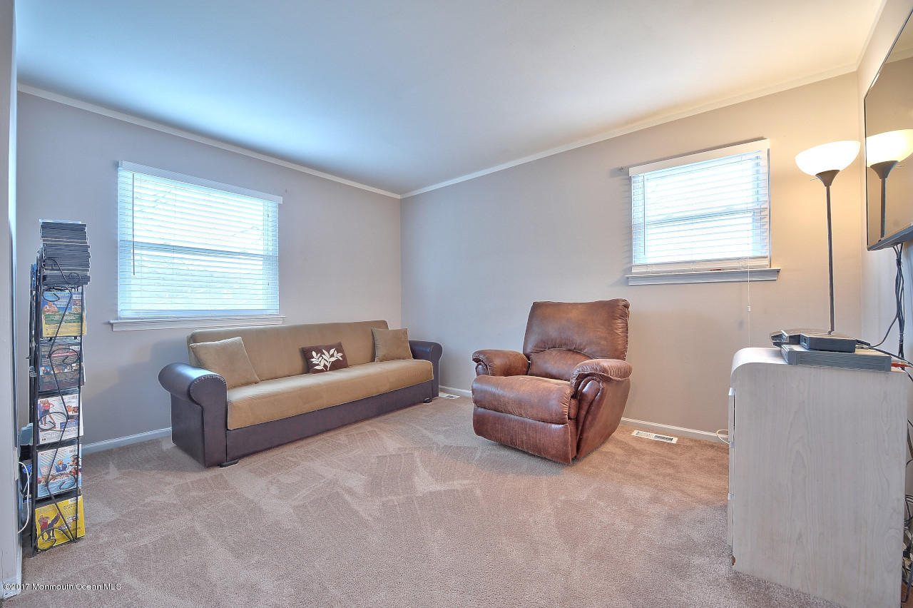 90 Starlight Road Howell, NJ 07731 - Photo 29 of 40 a living room with furniture and a window