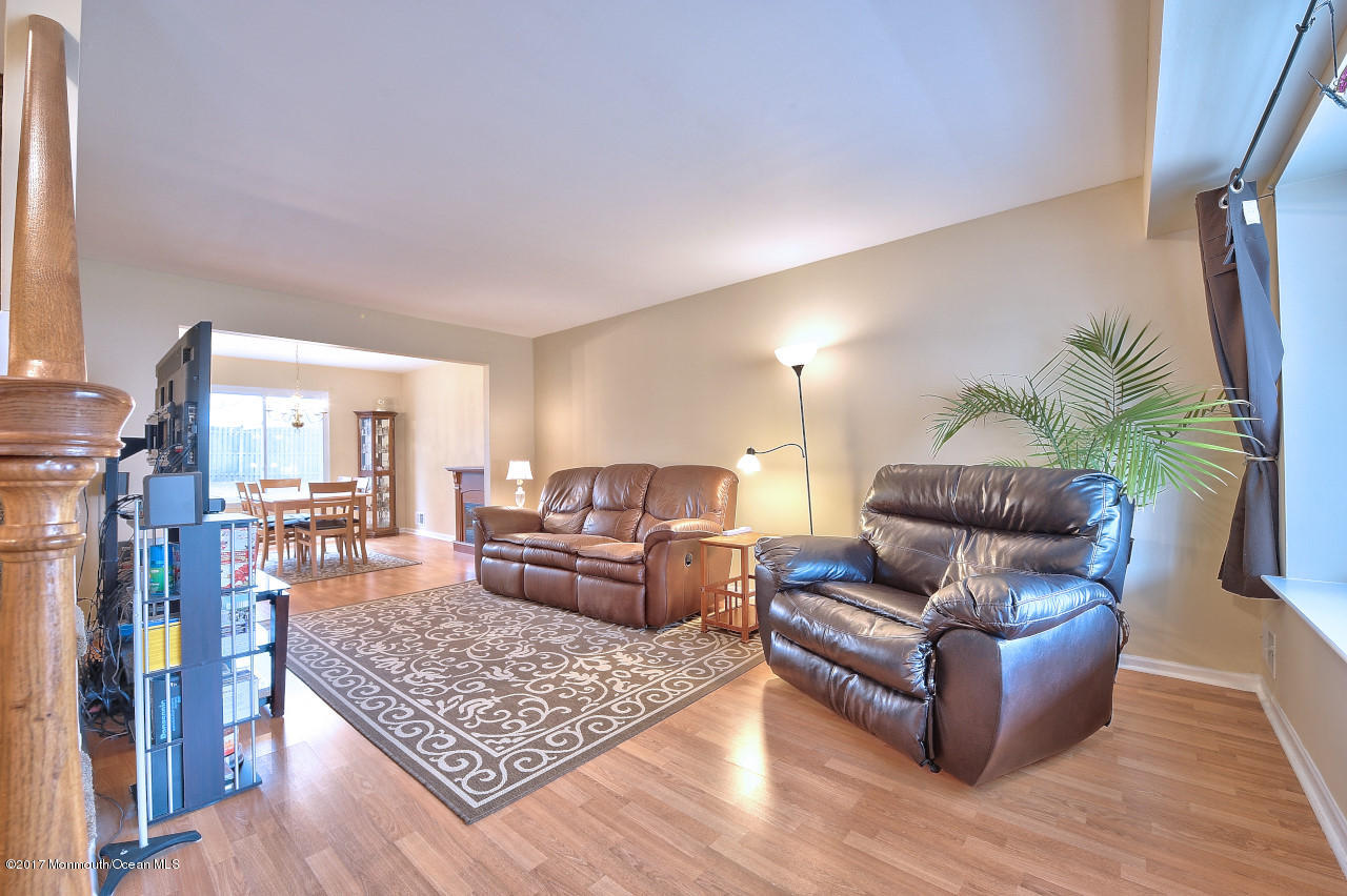 90 Starlight Road Howell, NJ 07731 - Photo 5 of 40 a living room with furniture and a couch