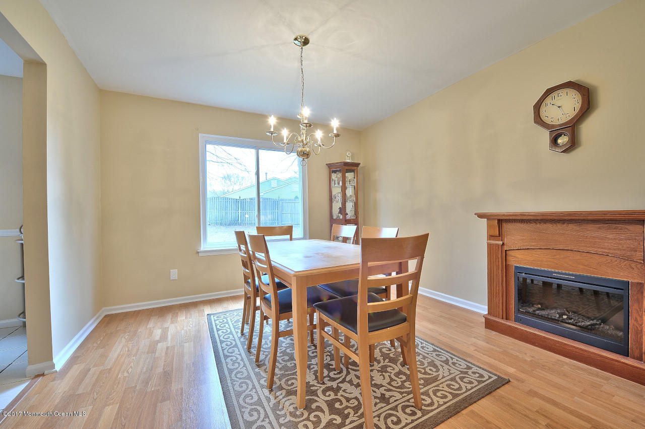 90 Starlight Road Howell, NJ 07731 - Photo 9 of 40 a view of a dining room with furniture window and wooden floor