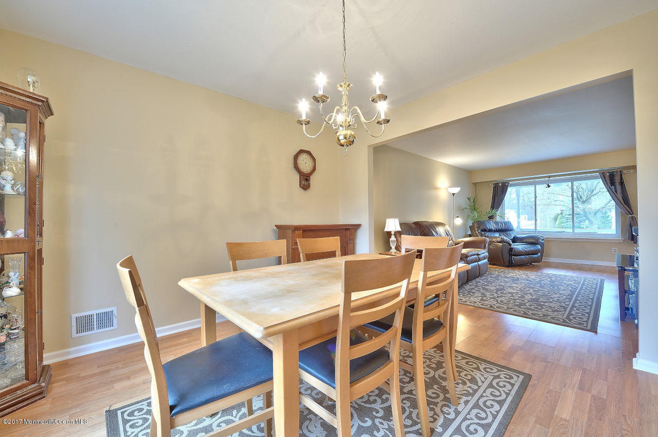 90 Starlight Road Howell, NJ 07731 - Photo 10 of 40 a view of a dining room with furniture window and wooden floor