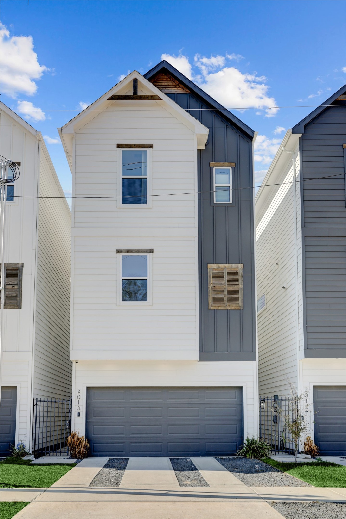 a front view of a house with garage