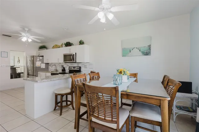 a view of kitchen with furniture and wooden floor