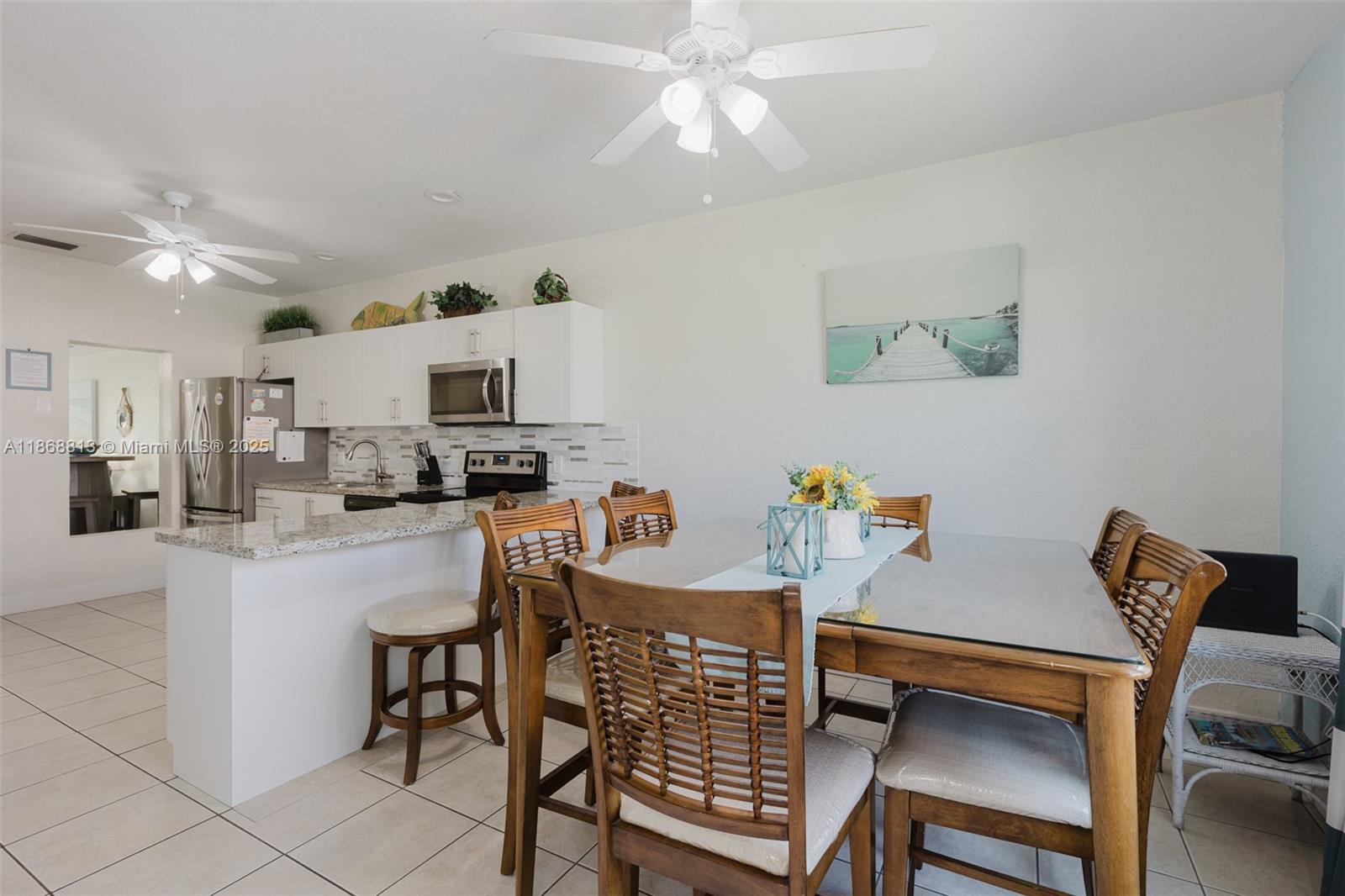 431 5th Street Key Colony Beach, FL 33051 - Photo 11 of 46 a view of kitchen with furniture and wooden floor