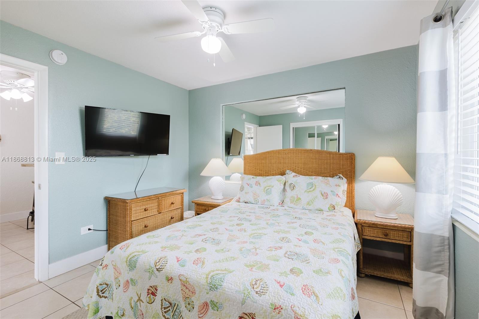 431 5th Street Key Colony Beach, FL 33051 - Photo 20 of 46 a bedroom with a bed and a flat screen tv