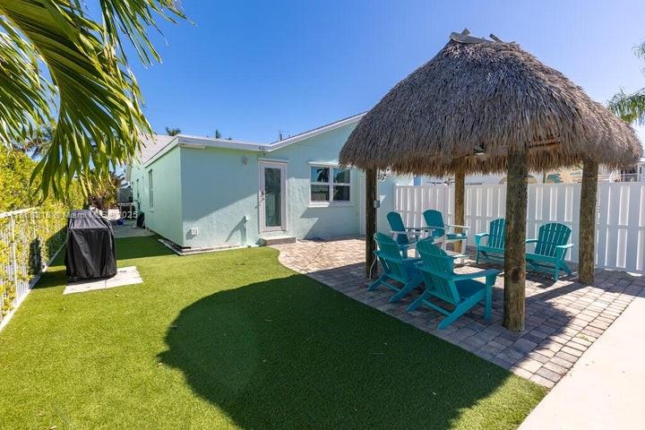 431 5th Street Key Colony Beach, FL 33051 - Photo 28 of 46 a view of a house with backyard and sitting area