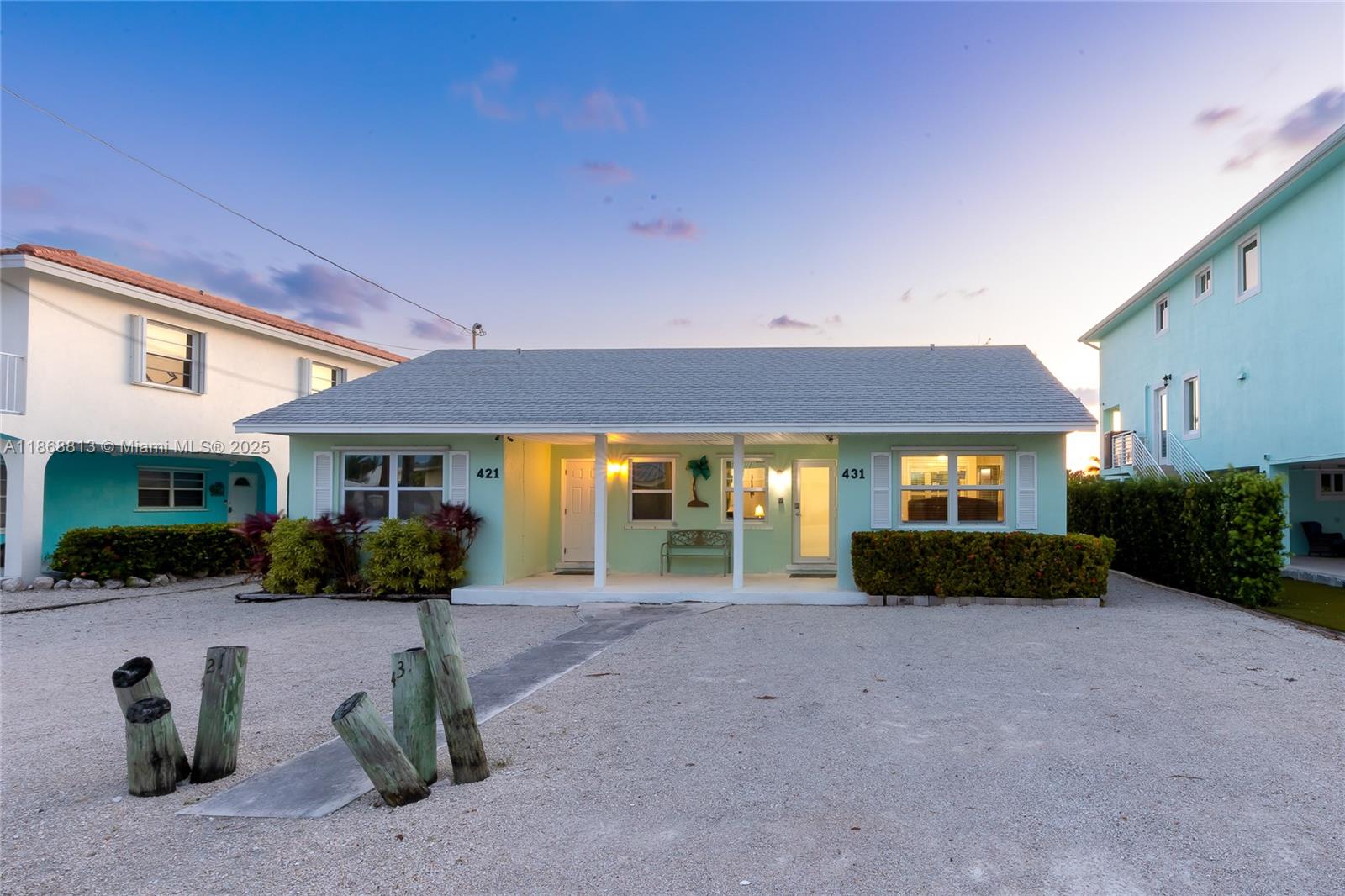 431 5th Street Key Colony Beach, FL 33051 - Photo 42 of 46 a front view of a house with garden
