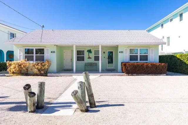 a view of a patio with table and chairs