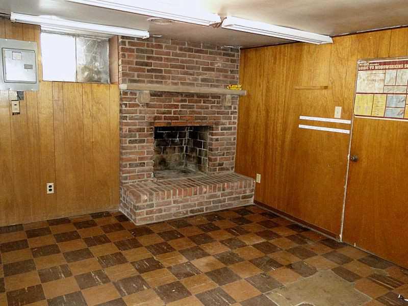 419 Coleman Road McDonald, PA 15057 - Photo 21 of 25 Great Room. Brunco wood burner in game room on lower level