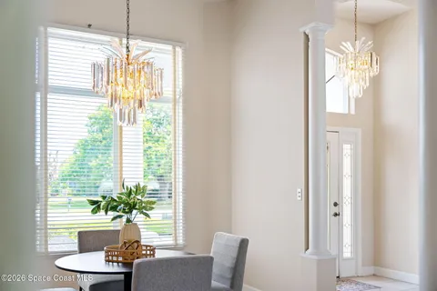 a view of a dining room with furniture window and outside view