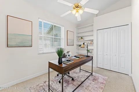 a utility room with cabinets washer and dryer