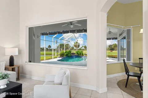 a living room with furniture and a large window